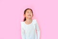 Portrait asian little girl crying isolated on pink background. Angry kid with sad expressions and screaming Royalty Free Stock Photo