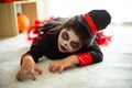 Portrait Asian little girl in Halloween costume acting scary and