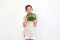 Portrait of asian little girl holding fresh green watermelon isolated on white background Royalty Free Stock Photo