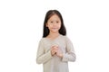 Portrait of Asian little girl praying gesture isolated on white background. Spirituality and religion faith hope concept Royalty Free Stock Photo