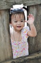 Portrait Asian little girl with smiling face plays outdoo Royalty Free Stock Photo