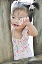 Portrait Asian little girl with smiling face plays outdoo Royalty Free Stock Photo