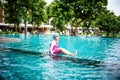 Portrait of Asian little girl swimming happily in the pool Royalty Free Stock Photo