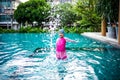 Portrait of Asian little girl swimming happily in the pool Royalty Free Stock Photo