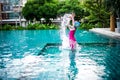 Portrait of Asian little girl swimming happily in the pool Royalty Free Stock Photo