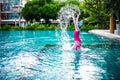 Portrait of Asian little girl swimming happily in the pool Royalty Free Stock Photo