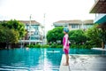 Portrait of Asian little girl swimming happily in the pool Royalty Free Stock Photo