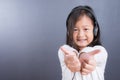 Portrait of asian little girl use headphone and smart phone Royalty Free Stock Photo