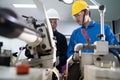 Portrait of Asian maintenance engineer workers working machines in the factory.