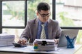 Portrait of asian male accountant working on desk calculating tax yearly financial Royalty Free Stock Photo