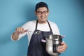 Asian Male Chef Making Soup, Chef Holding Kitchen Tool Pot and Ladle Royalty Free Stock Photo