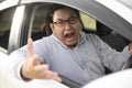 Angry Asian Male Driver, Screaming Pointing From His Car Royalty Free Stock Photo