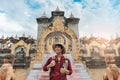 Portrait Asian man backpacker travel pagoda in southeast Asia Royalty Free Stock Photo