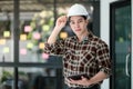 Portrait Asian man engineer holding tablet in the office. Royalty Free Stock Photo