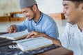 asian Man muslim reading quran together during ramadan at the mosque