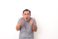 Portrait of Asian man stand happy and positive with thumbs up approving with a big smile and funny face expressing okay gesture Royalty Free Stock Photo