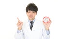 Doctor holds non smoking sign Royalty Free Stock Photo