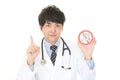 Doctor holds non smoking sign Royalty Free Stock Photo