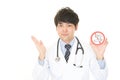 Doctor holds non smoking sign Royalty Free Stock Photo