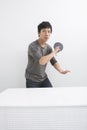 Portrait of Asian mid adult man playing table tennis Royalty Free Stock Photo