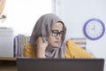 Tired Sleepy Muslim Businesswoman Waiting in Front of Her laptop Royalty Free Stock Photo