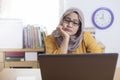 Tired Sleepy Muslim Businesswoman Waiting in Front of Her laptop Royalty Free Stock Photo