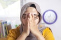 Tired Sleepy Muslim Businesswoman Waiting in Front of Her laptop Royalty Free Stock Photo