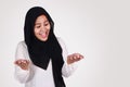 Muslim Woman Shows Empty Hands, Open Palm with Copy Space. Choose Left or Right Concept Royalty Free Stock Photo