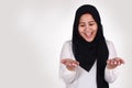 Muslim Woman Shows Empty Hands, Open Palm with Copy Space. Choose Left or Right Concept Royalty Free Stock Photo