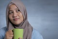 Muslim Businesswoman Taking Coffee Break at the Office Royalty Free Stock Photo