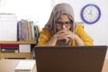 Muslim Businesswoman Working on Laptop at the Office, Thinking Gesture Royalty Free Stock Photo