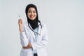 Muslim female doctor holding a syringe Royalty Free Stock Photo