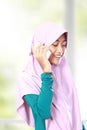 Portrait of an asian muslim kid talking on the cell phone Royalty Free Stock Photo