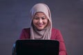 Muslim Lady Shows Winning Gesture, Receiving Good News on Her Email Royalty Free Stock Photo