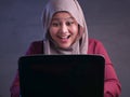 Muslim Lady Shows Winning Gesture, Receiving Good News on Her Email
