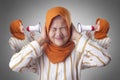 Asian Muslim Lady Close Her Ears Distracted by Inner Voice