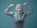 Muslim Lady Shows Strong Muscle Gesture Royalty Free Stock Photo