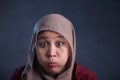 Muslim Woman Blowing or Puffing Cheek