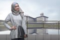Portrait of asian muslim woman with hijab holding laptop Royalty Free Stock Photo
