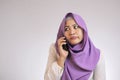 Muslim Woman Looks Annoyed Waiting on the Phone