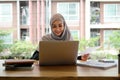 Portrait asian muslim woman manager working with laptop computer for business financial concept. Royalty Free Stock Photo