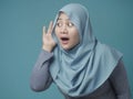 Muslim Woman Smiling While Doing Hearing Gesture Royalty Free Stock Photo