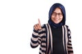 Portrait of Asian muslim woman smiling happily with finger pointing or touching virtual screen isolated on white, number one sign Royalty Free Stock Photo