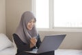 Muslim Woman Making Online Purchase Royalty Free Stock Photo