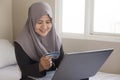 Muslim Woman Making Online Purchase Royalty Free Stock Photo