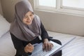 Muslim Woman Making Online Purchase Royalty Free Stock Photo