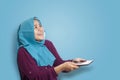 Muslim Woman Surprised to See Something Above when using Phone Royalty Free Stock Photo