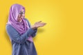 Muslim Woman Shows Copy Space Empty Palm Presenting Something