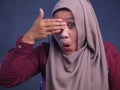 Muslim Woman Peeking Through Her Fingers Royalty Free Stock Photo