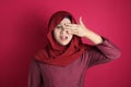 Muslim Woman Peeking Through Her Fingers Royalty Free Stock Photo